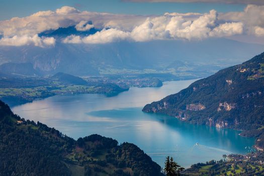 Aerial view of Swiss Alps and Lake Thun at dramatic sunset, Interlaken, Switzerland