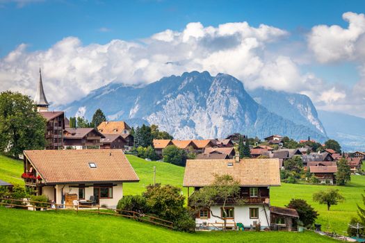 Idyllic landscape of Preda village in Engadine valley at springtime sunset, Swiss Alps, Switzerland