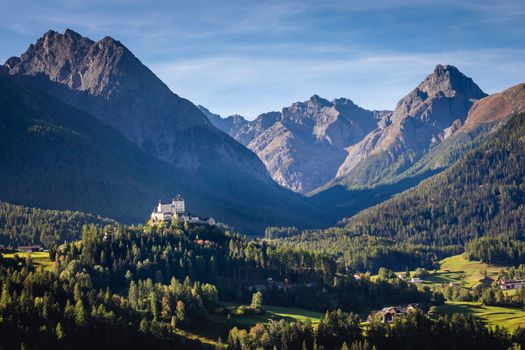 Above Idyllic landscape of Scuol Tarasp village at sunrise, Engadine, Swiss Alps, Switzerland