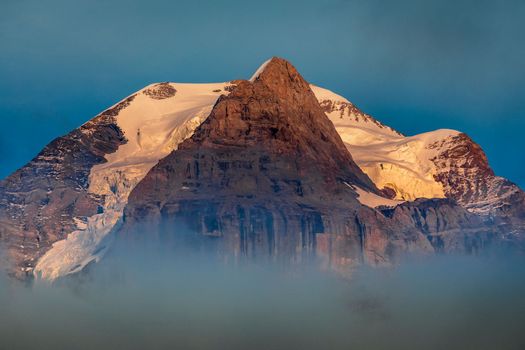 Misty Jungfrau Mountain, Snowcapped Bernese Swiss alps, view from Murren, Switzerland