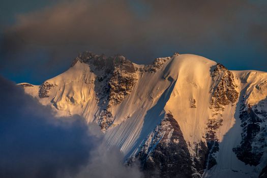 Misty Jungfrau Mountain, Snowcapped Bernese Swiss alps, view from Murren, Switzerland
