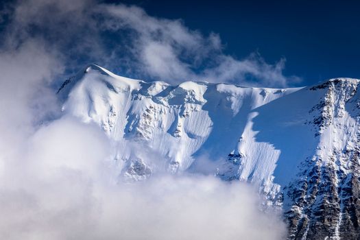 Misty Jungfrau Mountain, Snowcapped Bernese Swiss alps, view from Murren, Switzerland