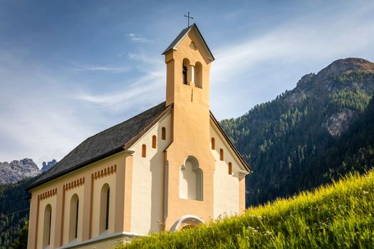 Idyllic landscape of Ardez church at sunrise, Engadine, Swiss Alps, Switzerland