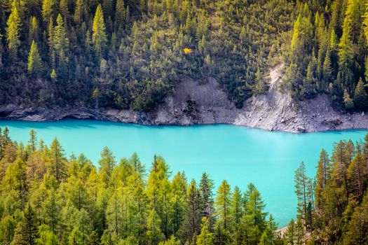 Turquoise alpine lake in Swiss national park at sunny day, Switzerland