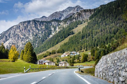 Mountain road in Engadine, dramatic road with swiss alps, Switzerland at sunny day