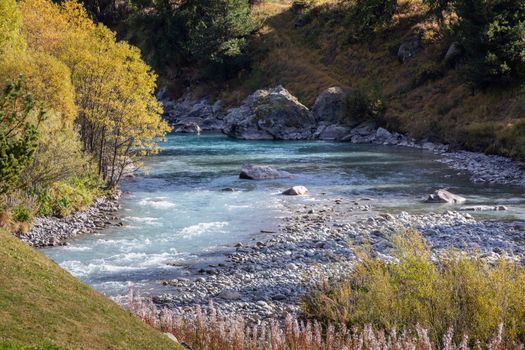 Alpine river in Fluela pass, Engadine Valley at sunrise, Graubunden alps, Grisons, Switzerland