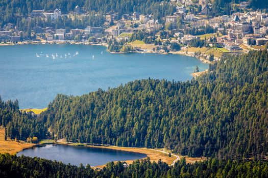 Panoramic view of St Moritz lake with sailboats from Muottas Muragl of Upper Engadine, Graubunden, Switzerland