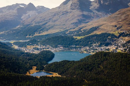 Panoramic view of St Moritz lake with sailboats from Muottas Muragl of Upper Engadine, Graubunden, Switzerland