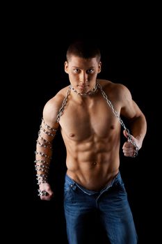 yong athletic naked man posing with chain on hands