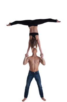 Couple of young gymnast show stand on hand isolated