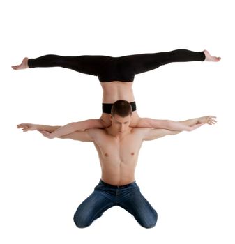 Couple of young gymnast show stand on hand isolated