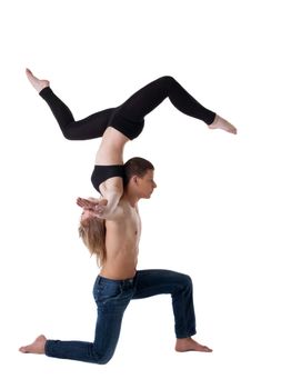 Couple of young gymnast show stand on hand isolated