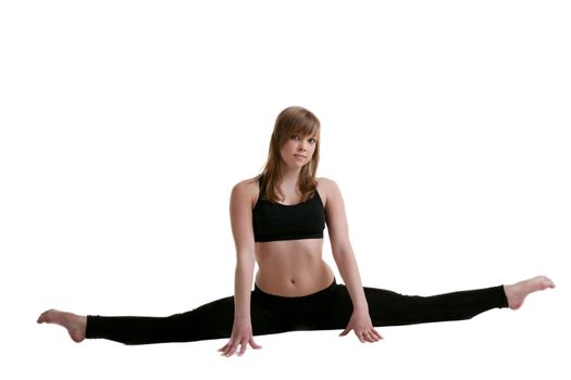 young gymnast in black show split isolated