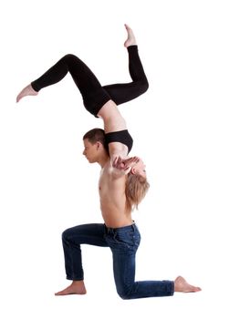 Couple of young gymnast show stand on hand isolated