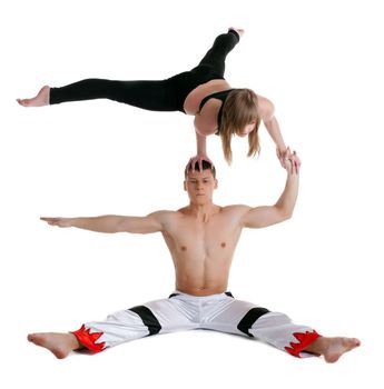 Couple of young gymnast show stand on hand isolated