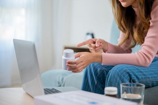 Telemedicine. Sick patient sit on sofa online consultation with doctor on laptop computer talking about illness and medication via video call at home, medical and health care technology online concept