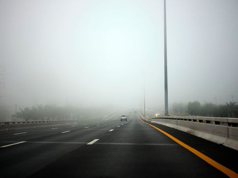 Road in the fog, sign mention keep distance for Motorway-t7.svg THAILAND