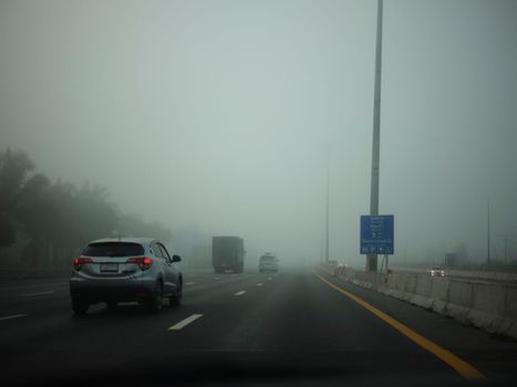 Road in the fog, sign mention keep distance for Motorway-t7.svg THAILAND