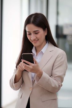 A businesswoman completes KYC using an online banking program in order to open a digital savings account. The definition of cyber security.