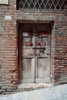 Old house entrance with many latches.