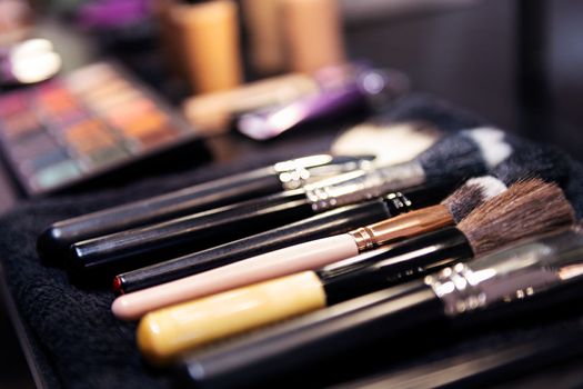 brushes in the workplace of a professional makeup artist, concept of beauty salon and skin care