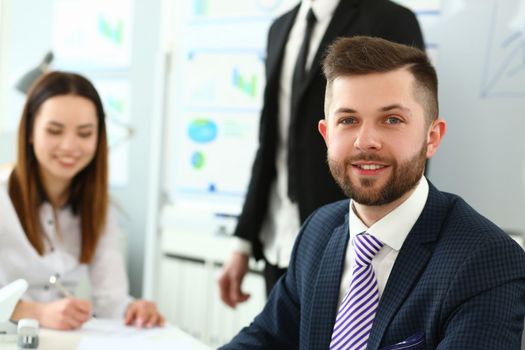 Portrait of handsome young man at business meeting. Joint successful teamwork concept