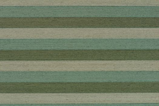 Striped green wood texture. Wooden shield glued from different types of wood in natural green color, top view.