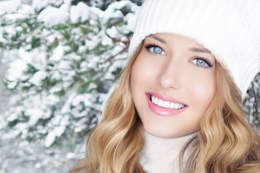 Winter holiday travel, lifestyle and fashion, beautiful happy woman and snowy forest, nature, ski resort and leisure activity outdoors Christmas, New Year and holidays portrait.