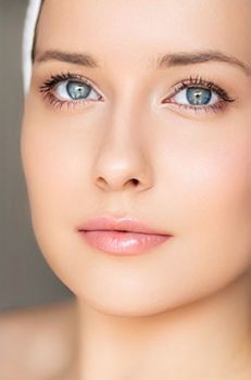 Skin care and beauty routine, beautiful woman with white towel wrapped around head, skincare cosmetics and face cosmetology, close-up portrait