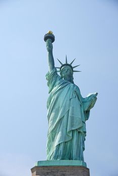 Liberty Statue, a landmark of new york city, with blue sky