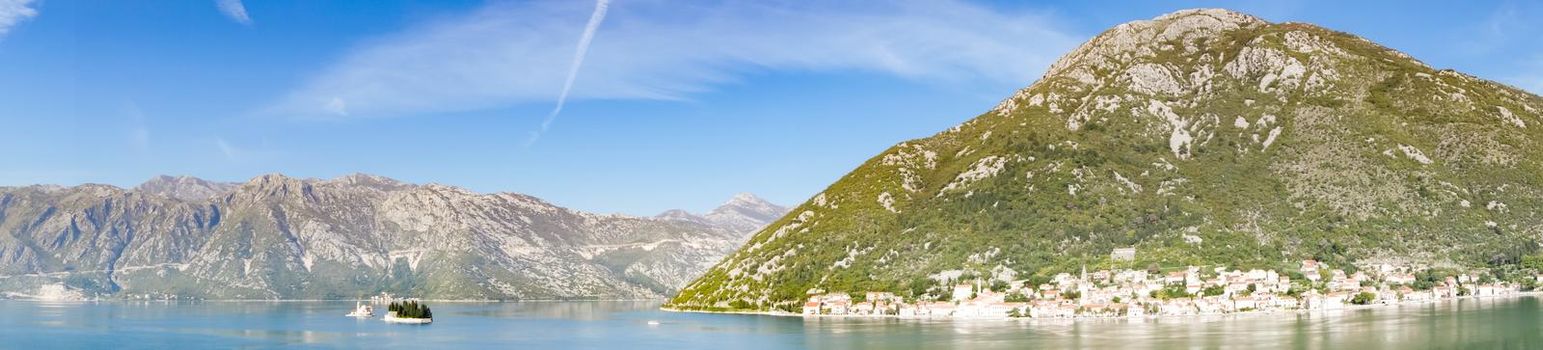 Panoramic view of Bay of Kotor from the sea surrounded by mountains in Montenegro, one of the most beautiful bay in the world.