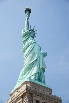 Liberty Statue, a landmark of new york city, with blue sky