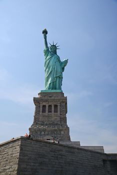 Liberty Statue, a landmark of new york city, with blue sky