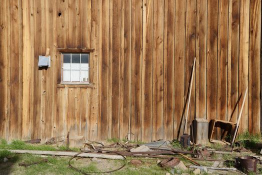 a wooden wall in Bodie historic state park of a ghost town from a gold rush era in Sierra Nevada