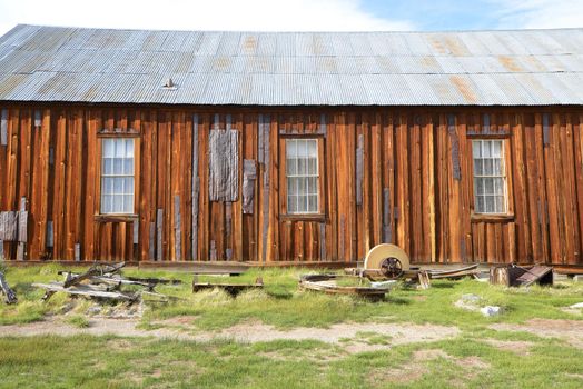 a wooden wall in Bodie historic state park of a ghost town from a gold rush era in Sierra Nevada