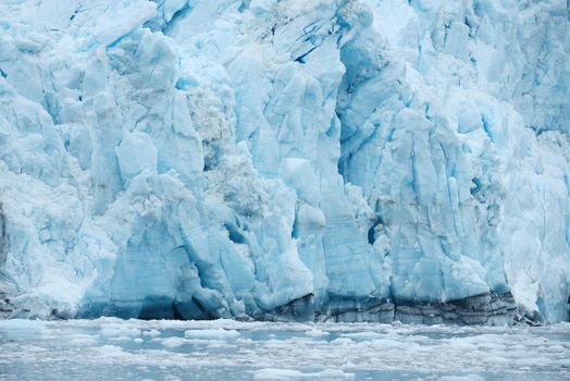 blue color of tidewater glacier in prince william sound in alaska