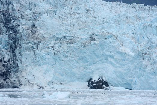 blue color of tidewater glacier in prince william sound in alaska