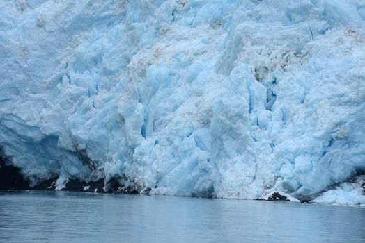 blue color of tidewater glacier in prince william sound in alaska