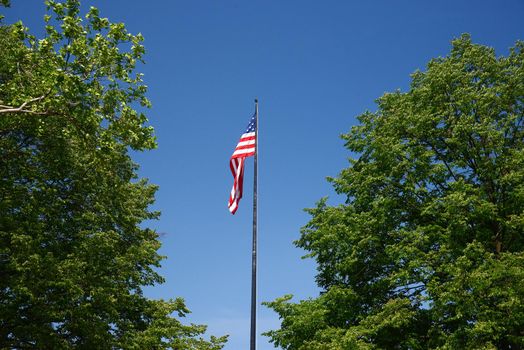 american flag with blue sky