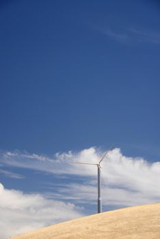 wind power turbine on golden grass hills