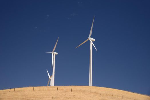 wind power turbine on golden grass hills