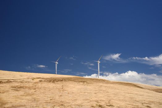 wind power turbine on golden grass hills