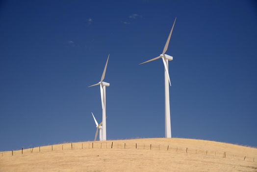 wind power turbine on golden grass hills