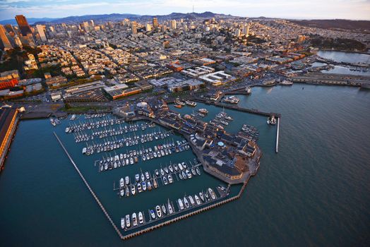 an aerial view of downtown san francisco with pier during sunset