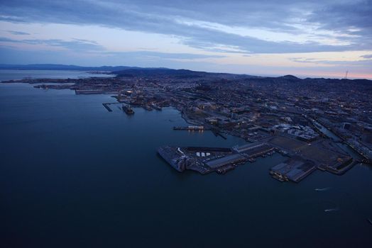 an aerial view of downtown san francisco with pier during sunset