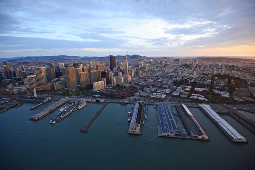 an aerial view of downtown san francisco with pier during sunset