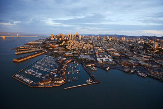 an aerial view of downtown san francisco with pier during sunset