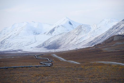 oil pipeline with mountain in northern alaska