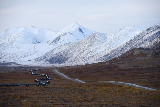 oil pipeline with mountain in northern alaska