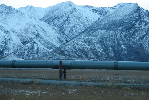 oil pipeline with mountain in northern alaska